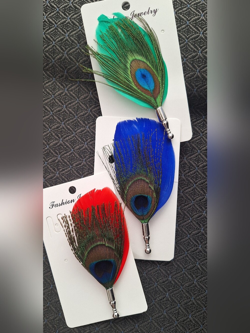 Bundle of three brooch pins made with peacock feathers